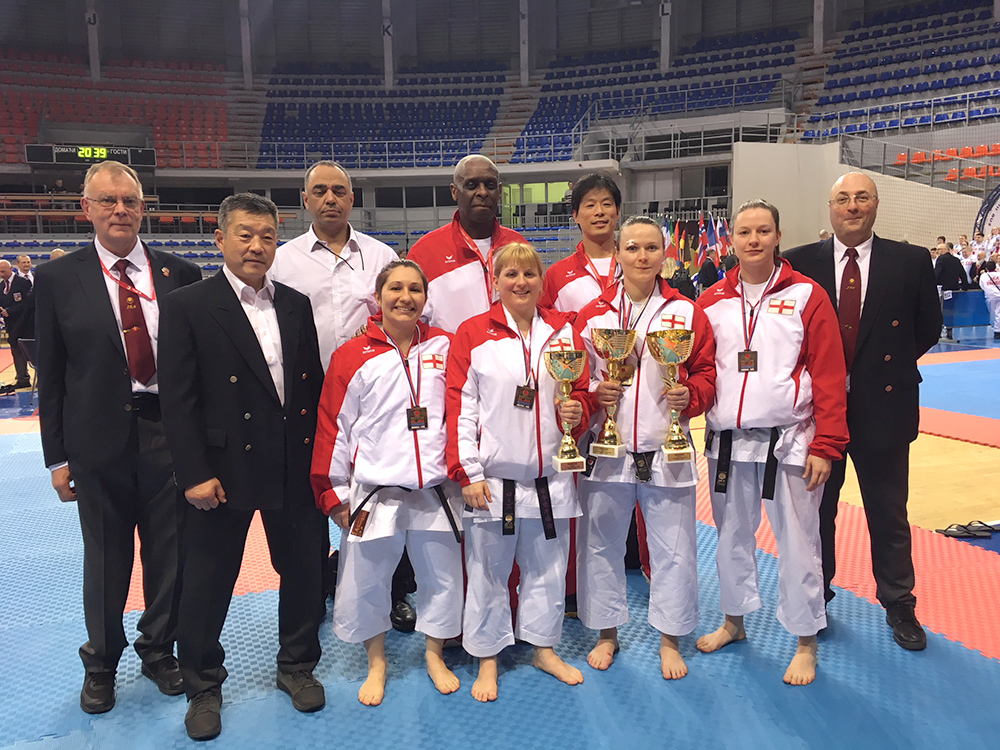 . Sensei Martin with Sensei Ohta, the other referees and the Womens Team who also won Bronze