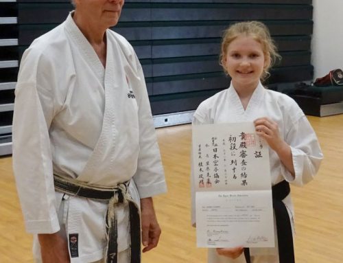 Monika receiving her JKA 1st Dan Diploma from Sensei Martin